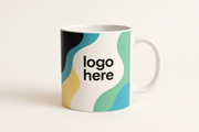 black, green, blue, white, and pastel yellow coffee mug that say logo here